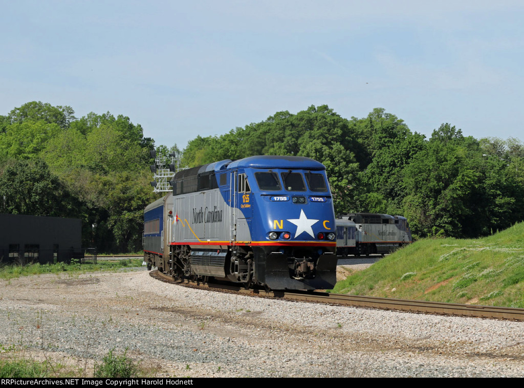 RNCX 1755 is on the rear of train P075-25 as it heads for the station